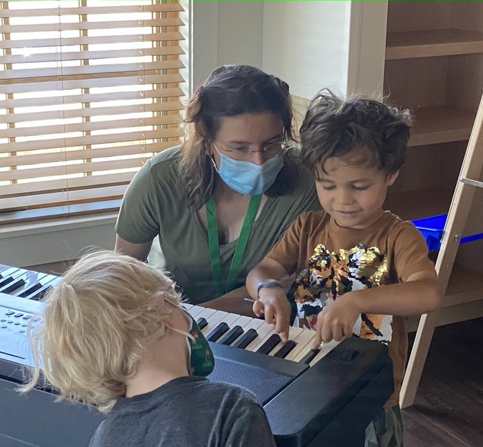 Piano lesson with young children